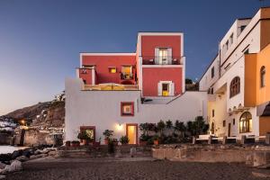 a group of buildings in a town at night at Appartamenti Le Pleiadi - Sant'Angelo D'Ischia in Ischia