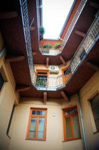 a view from the inside of a building with stairs at Sunny Apartman in Szeged