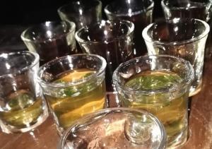a group of glasses of whiskey on a table at Marco Polo Party Hostel in St. Julianʼs