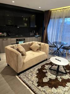 a living room with a couch and a table at Cosy Home in Westlands in Nairobi