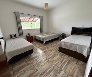 Postel nebo postele na pokoji v ubytování Recanto Vó Rosa + 38 fotografií