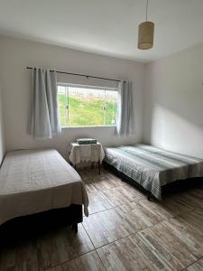 Postel nebo postele na pokoji v ubytování Recanto Vó Rosa