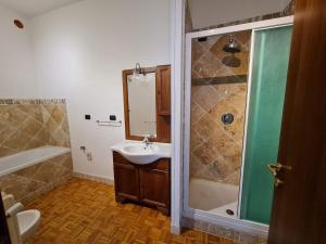 a bathroom with a sink and a shower at DORMI DA ME DORMI DA RE in Amandola