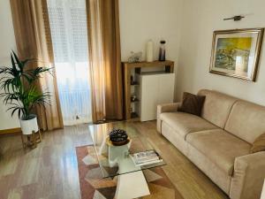 a living room with a couch and a coffee table at Giada Apartment in Verona