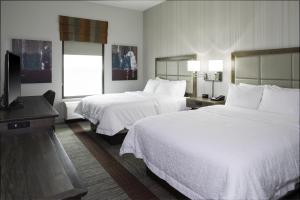 a hotel room with two beds and a flat screen tv at Hampton Inn & Suites Pittsburg Kansas Crossing Casino near Pitt State Univ in Pittsburg +19 photos