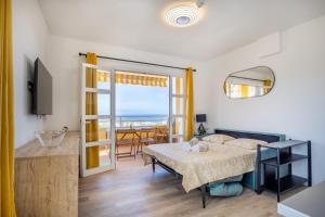 a bedroom with a bed and a view of the ocean at Great Ocean View Torviscas Beach Home by LoveTenerife in Adeje