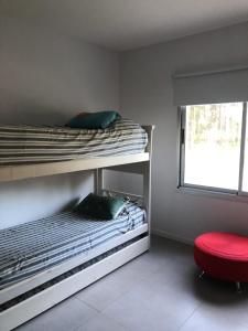 Una cama o camas cuchetas en una habitación  de Schnauzer de Playa