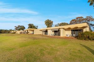 a house with a large yard in front of it at Comfort Inn & Suites Riverland in Barmera