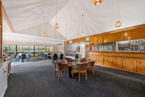 a dining room with a table and some chairs at Comfort Inn & Suites Riverland in Barmera