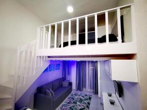 a living room with a staircase and a couch at Loft VIP in Naama bey in Sharm El Sheikh