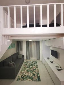 a living room with a couch and a loft at Loft VIP in Naama bey in Sharm El Sheikh