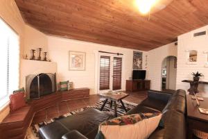 a living room with a couch and a fireplace at Cozy Adobe in Pahrump