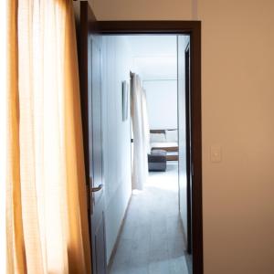 a door leading to a hallway with a room at La gran sirena in Cuchilla Alta