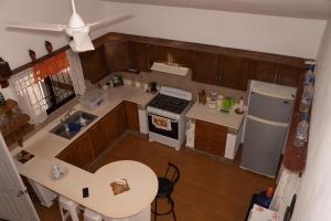 an overhead view of a kitchen with a stove and refrigerator at Villa Rosandri in Bayahibe