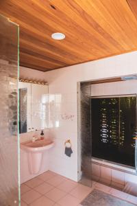 a bathroom with a sink and a shower at High Grange Luxury Mountain Retreat - Pool, Spa, Sauna in Kalorama