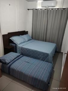 Postel nebo postele na pokoji v ubytování CASA CLIMATIZADA COM HIDROMASSAGEM PRÓXIMO BETO CARRERO E PRAIAS - Casa 1 DuMar Hospedagem