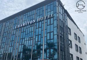a building with a sign on the side of it at Chariton Hotel Skudai Kiri in Johor Bahru