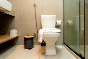 a bathroom with a toilet and a glass shower at Apartamentos Decorados Próximos mar in João Pessoa