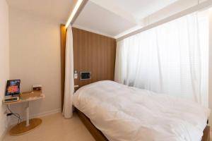Una cama o camas en una habitación de SLEEPLAB THE STAY 渋谷 -睡眠特化型Hotel-