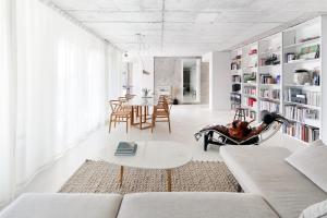 a living room with a couch and a table at Beautiful design Belem Ap 115m2 in Lisbon
