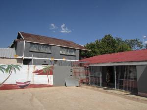 a house with a painting on the side of it at Mokopane at Freedom City Lodge in Mokopane