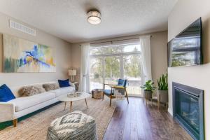 a living room with a couch and a fireplace at Riverside Villa in Kitchener