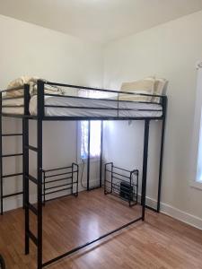 a bedroom with two bunk beds in a room at The Zen Home near Temple U & Drexel FREE STREET PARKING in Philadelphia