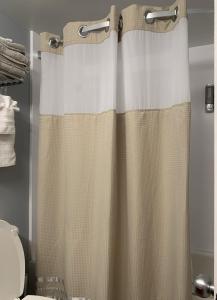 a shower curtain in a bathroom with a toilet at Lee's Myrtle Beach Condo in Myrtle Beach