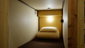 Postel nebo postele na pokoji v ubytování Hostel Furoya