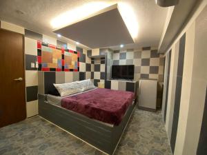 Säng eller sängar i ett rum på Anak Jay Ang