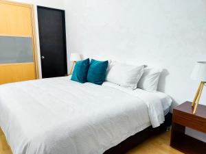 Cama ou camas em um quarto em Punto Alameda - Reforma