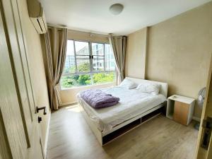 a small bedroom with a bed and a window at 2 Bedrooms 2 bath Apartment in Chiang Mai
