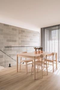 a dining room with a table and chairs at Stadium View Townhouse in Geelong