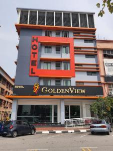 a building with a sign for a golden view at Hotel Golden View Nilai in Nilai