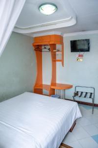 เตียงในห้องที่ Jupiter Guest Resort - Langata