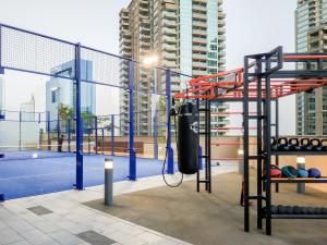 a gym with a punching bag on top of a building at Maison Privee - Modern Luxury Apt with Spectacular Dubai Marina Vws in Dubai