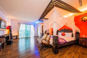 Postel nebo postele na pokoji v ubytování Seasons Bali Fashion Inn