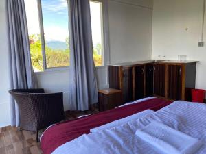 Gulta vai gultas numurā naktsmītnē Panoramic View Guest House Sarangkot