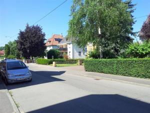 a car parked on the side of a street at ALFA Stuttgart 3BR 5 Beds Netflix INET EBK Wasen in Stuttgart