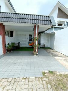 an outdoor patio with awning on a house at Canal Studio Room Kota Bharu in Kota Bharu