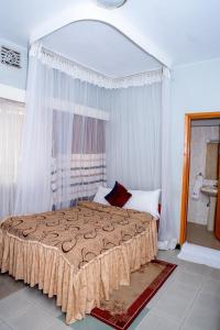 Postel nebo postele na pokoji v ubytování Jupiter Guest House - Parklands