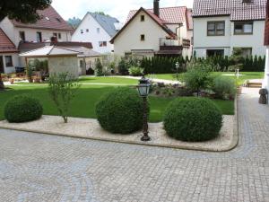 a courtyard with a street light and some bushes at Ferienhaus Villa Marina in Bad Urach
