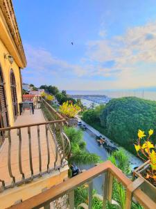 a balcony view of a river from a house at Hotel Garibaldi in Milazzo