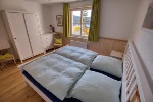 Ένα ή περισσότερα κρεβάτια σε δωμάτιο στο Zum Alten Wärterhaus