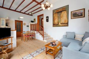 a living room with a couch and a table at La Huerta in Hermigua