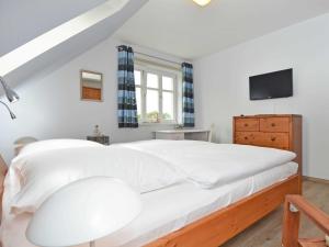 Postel nebo postele na pokoji v ubytování Haus Mönchgut - Haushälfte 1 "Feuerstein"