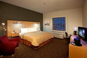 Säng eller sängar i ett rum på Hotel Artesia