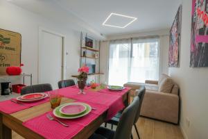 a dining room table with a red tablecloth on it at BergamoCityCenter 04 in Bergamo