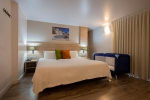 Llit o llits en una habitació de Hotel Del Pui