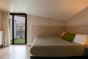 Llit o llits en una habitació de Hotel Del Pui